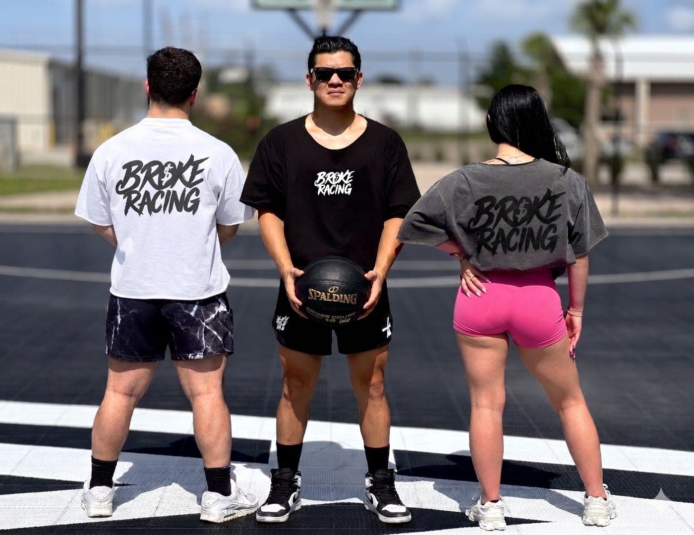 Three friends repping Broke Racing tees
